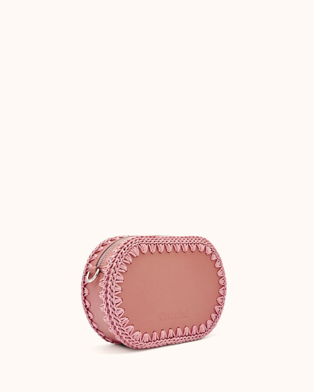 Bolso ovalado pequeño artesanal rosa de cuero y crochet hecho a mano por Cueché